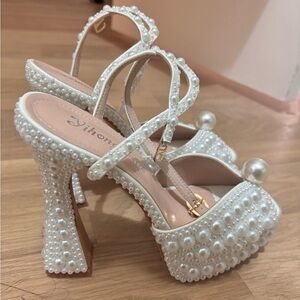Pearl white platform heels.